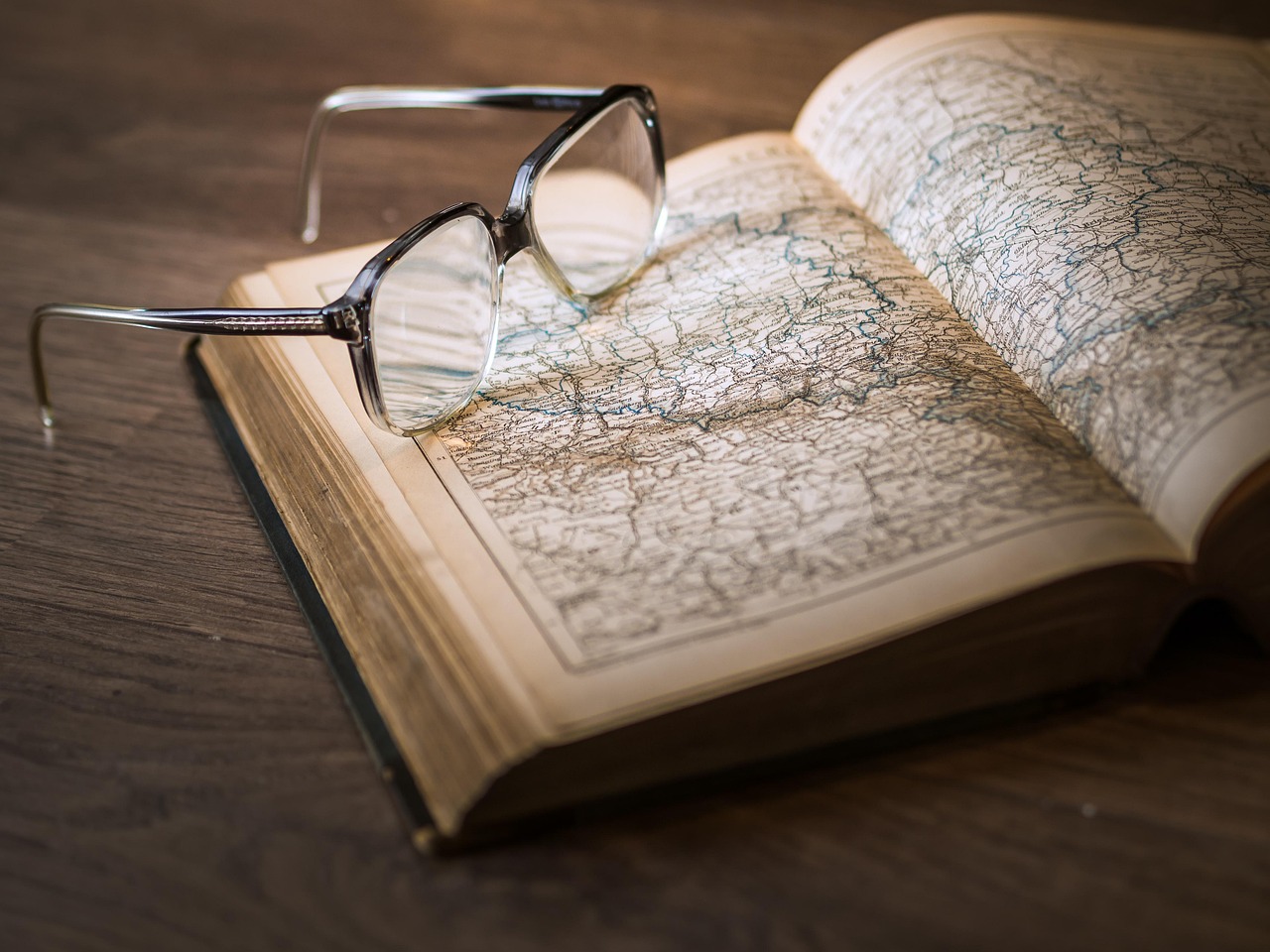 photograph of atlas book open to world map